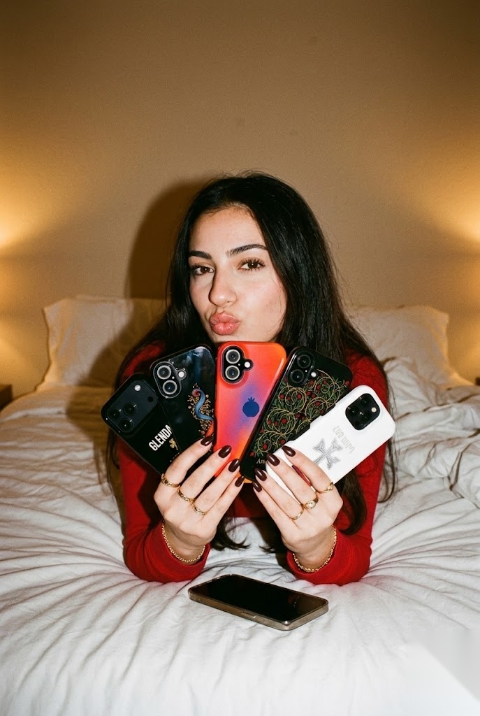 Model fanning out the NRAN Armenian phone case collection